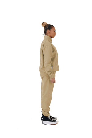 A wholesale supply of oversized nylon jackets with matching oversized nylon joggers is available.